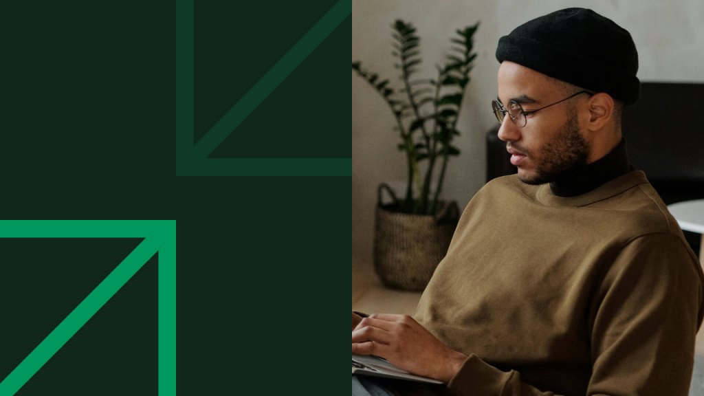 Focused man working on laptop researching passive income investments