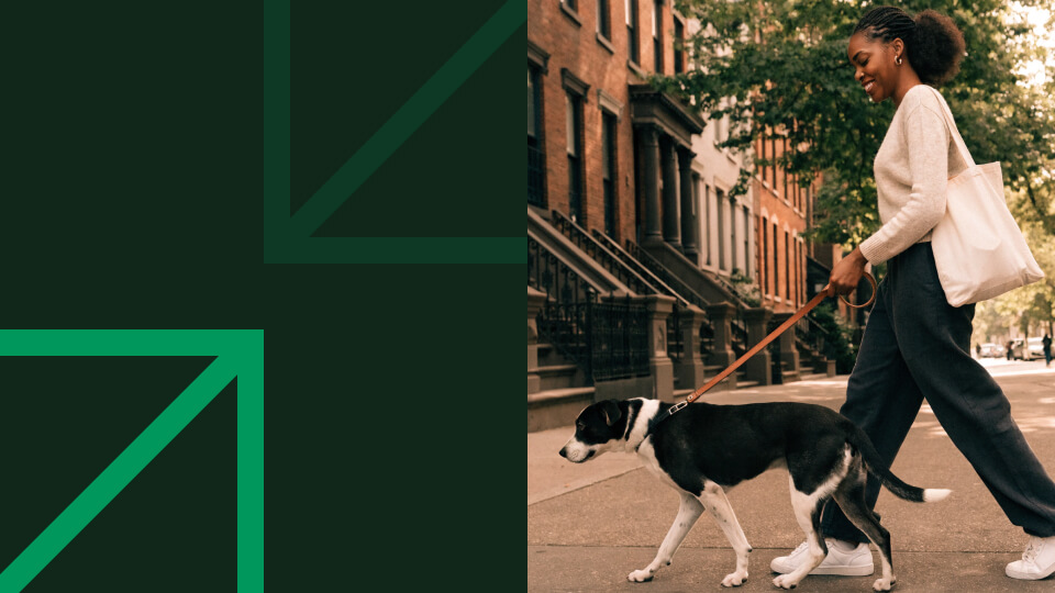 Woman walking her dog in Brooklyn on a sunny morning — what are ETFs